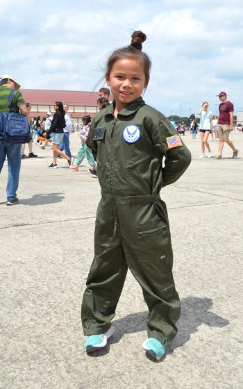 Giana Adonay, 7, dressed in a flight suit for The Great Texas Airshow on Saturday, April 6, 2024, at Joint Base San Antonio-Randolph Air Force Base.