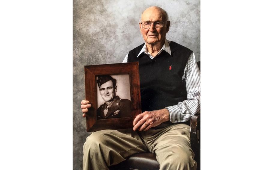 Gabriel Kinney, who served with Merrill’s Marauders during World War II, holds a photo of himself in uniform in this undated photo.