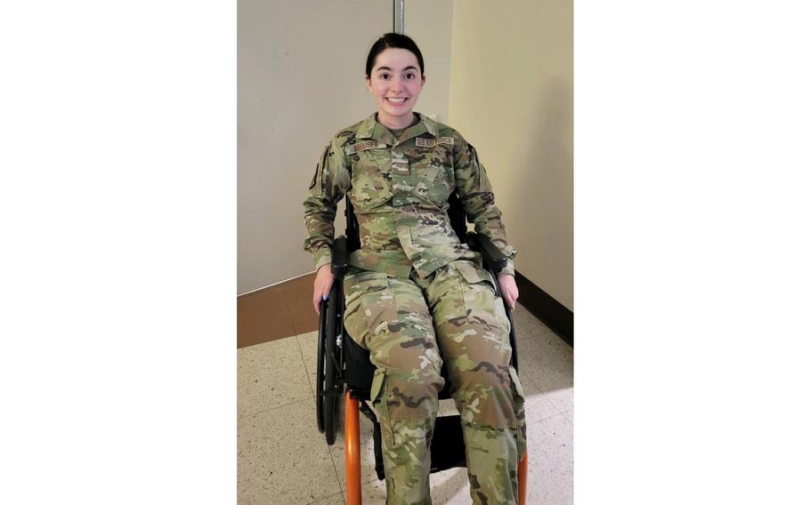 U.S. Air Force Airman 1st Class Lauren Arduser, 311th Training Squadron Russian language analyst, celebrates putting her uniform on independently, at the St. Louis VA Healthcare System-Jefferson Barracks, Mo., in May 2022. 