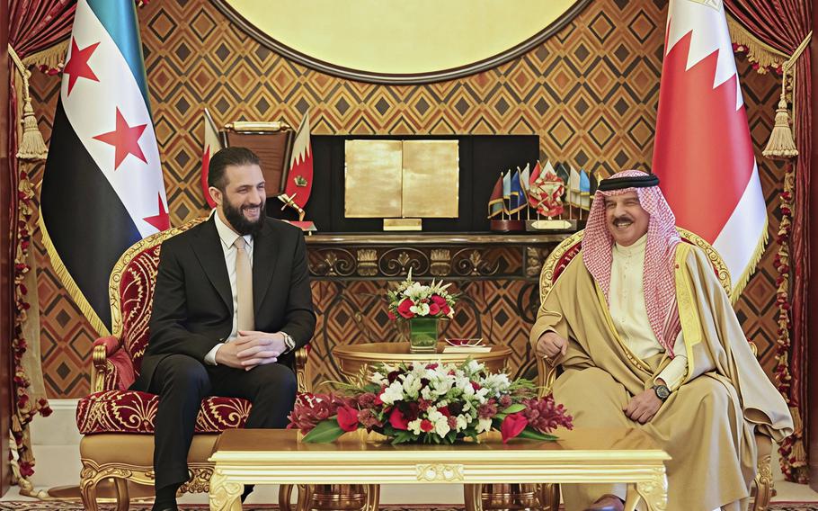 Bahrain’s King Hamad bin Isa Al Khalifa, right, meets with Syrian President Ahmad al-Sharaa, at the Sakhir Royal Palace in Manama, Bahrain.