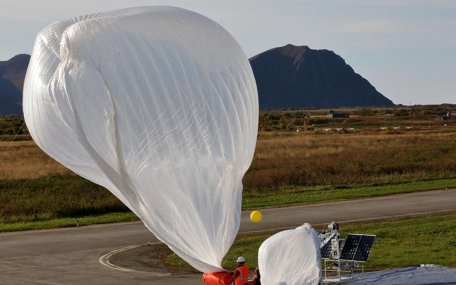 An electronics and engineering team from Raven Aerostar launches a high altitude balloon from Andoya Air Station to sense a simulated target in the Norwegian Sea during the Thunder Cloud live-fire exercise in Andoya, Norway, Sept. 15, 2021. Three high altitude balloons were launched into the stratosphere and relayed data to project coordinates for soldiers firing precision artillery. 