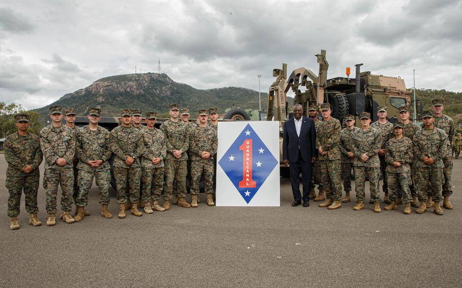 U.S. Secretary of Defense Lloyd J. Austin III and U.S. Marines with 1st Marine Division pose for a photo during Exercise Talisman Sabre 23 at Lavarack Barracks in Townsville, Australia, July 30, 2023. Talisman Sabre is the largest bilateral military exercise between Australia and the United States.