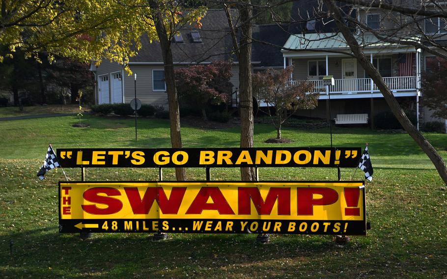 A “Let’s Go Brandon” sign rests in the yard of a house in Knoxville, Maryland in November 2021.