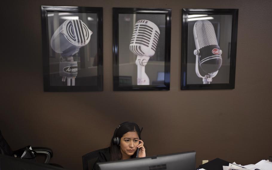 Bryan Broadcasting sales representative Nelly Mauricio talks on the phone at the station in College Station, Texas. 