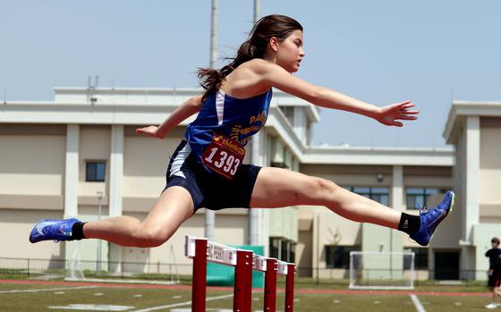 Yokota freshman Bethany Sobieralski navigates the 100 hurdles during Saturday's meet at Perry.
