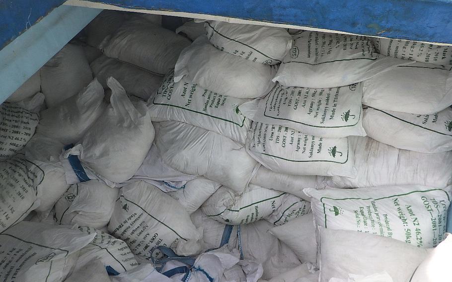 Bags of urea fertilizer and ammonium perchlorate are stored a cargo compartment on board a fishing vessel intercepted by U.S. naval forces while transiting international waters in the Gulf of Oman, Nov. 8.