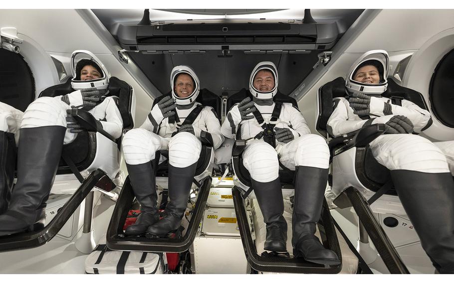 NASA astronauts, from left, Jessica Watkins, Robert Hines, Kjell Lindgren, and European Space Agency astronaut Samantha Cristoforetti are seen inside the SpaceX Crew Dragon Freedom spacecraft onboard the SpaceX recovery ship Megan shortly after having landed in the Atlantic Ocean off the coast of Jacksonville, Fla., on Oct. 14, 2022.  
