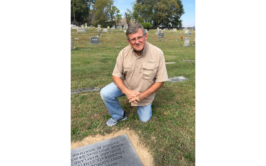 Gary Holland at the granite marker in Gastonia’s Hollywood Cemetery, which marks the service of his great-great-great grandfather William Taylor Ingram.