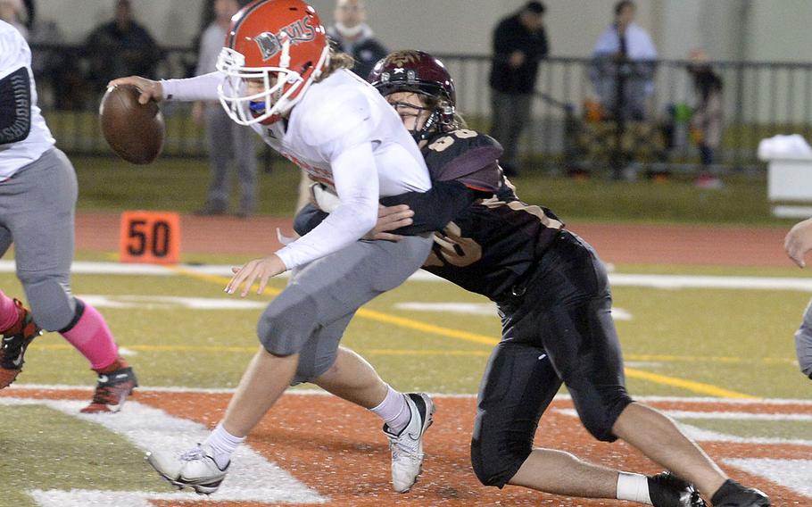 On one of the few times things didn't go right for Kinnick, quarterback Zeke DeLaughter is sacked by Perry's Kirby Kendrick.