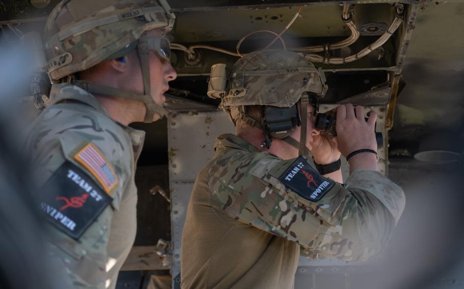 U.S. soldiers look for targets Aug. 8, 2022, during the European Best Sniper Team Competition at Hohenfels Training Area in Germany.