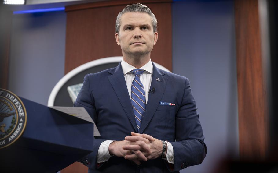 Hegseth standing at a podium at the Pentagon. 