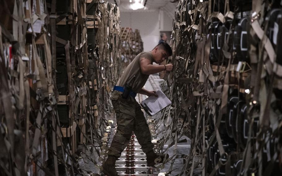 Senior Airman Jansen Esteves, 436th Aerial Port Squadron special handler, verifies shipment information for supplies bound for Ukraine during a foreign military sales mission at Dover Air Force Base, Del., March 20, 2022.