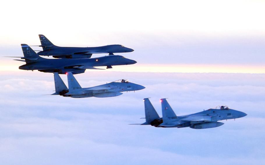 Two Air Force B-1B Lancer bombers fly alongside a pair of Japanese F-15 Eagle over the Sea of Japan Thursday, Jan. 18, 2024.