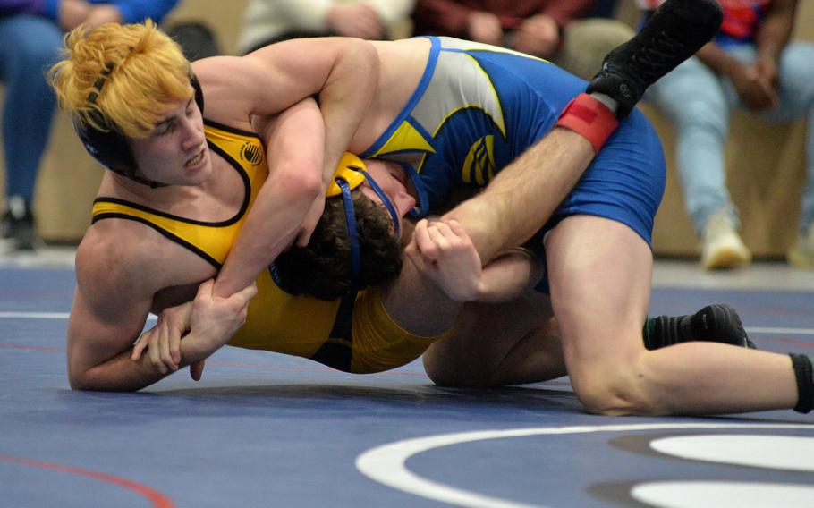 Stuttgart’s Evan Vertuli, left, defeated Wiesbaden’s Linx Lawless in the 126-pound final at the high school 2022 Wrestling Tournament in Ramstein, Germany, Feb. 12, 2022.