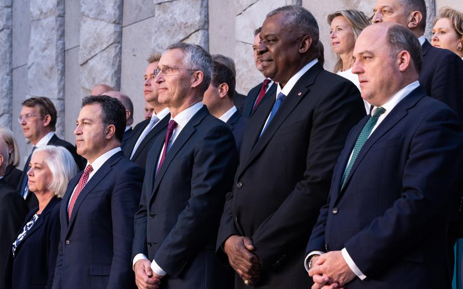 From left, Albanian Defense Minister Niko Peleshi, NATO Secretary-General Jens Stoltenberg, U.S. Defense Secretary Lloyd Austin and United Kingdom Defense Secretary Ben Wallace stand for a group photo during a meeting of NATO defense ministers, June 16, 2023 in Brussels.