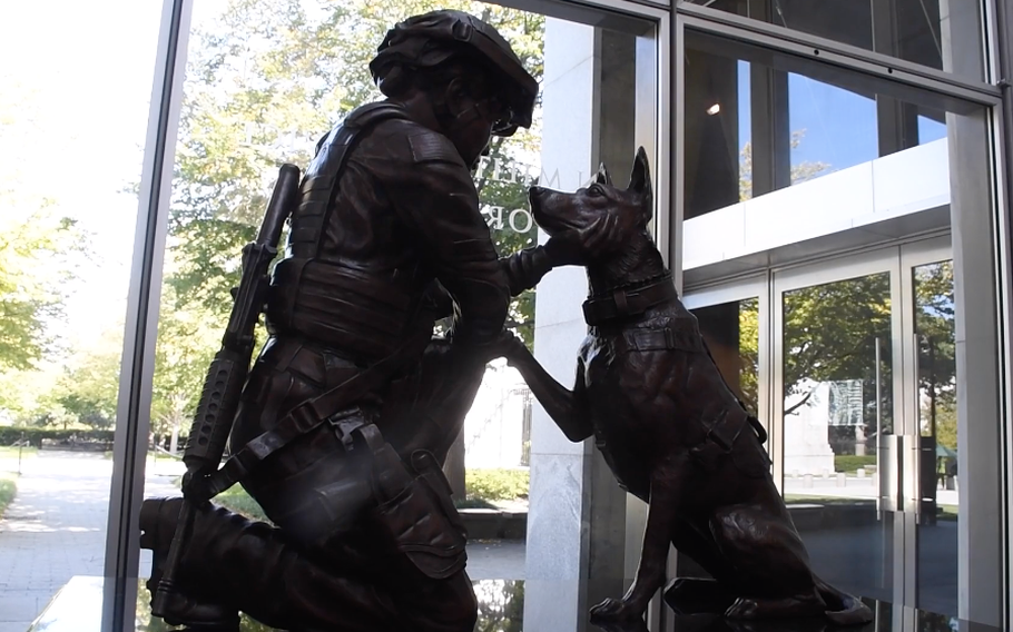 The Pledge statue at the entrance of the Women in Military Service for America Memorial.