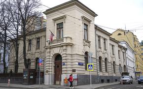 A building on a street corner.