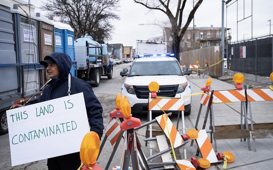 Roberto Silvestre protests at the gate of the tent city in the Brighton Park neighborhood on 38th Street as work is underway, Monday, Nov. 27, 2023. 