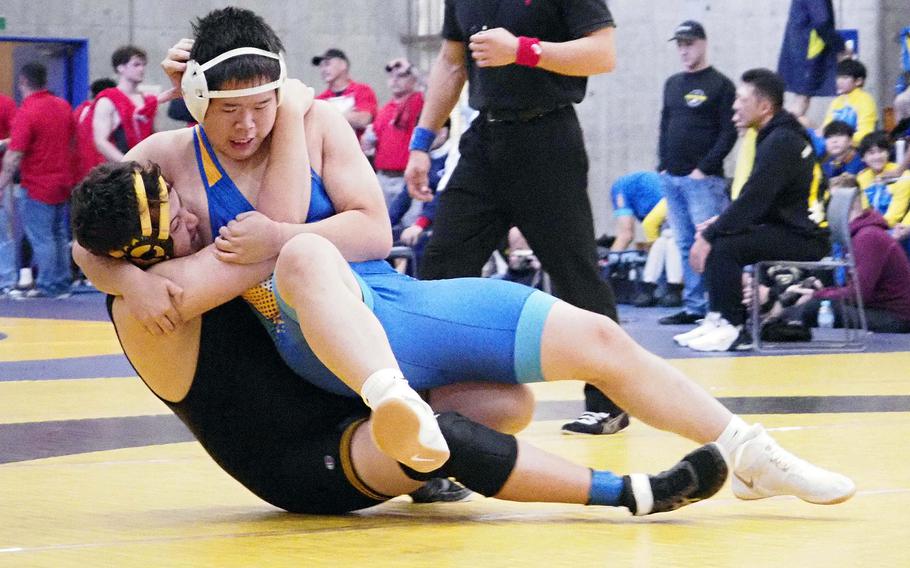 St. Mary's Kei Fujita takes down American School In Japan's Kent Kampa at 189 pounds during Saturday's Christian Academy Japan Invitational Tournament.