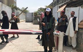 Taliban fighters stand guard at a checkpoint near the U..S embassy that was previously manned by American troops, in Kabul, Afghanistan, Aug. 17, 2021. 