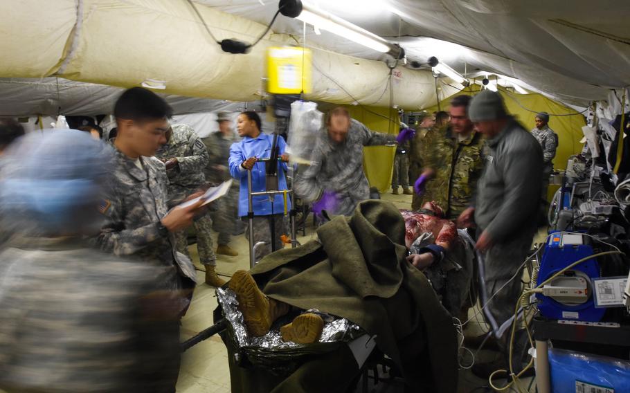 U.S. soldiers treat a mock burn victim during an exercise in Germany in 2016. A five-year Army study in Florida will use ultrasound to examine burn wounds and allow for better understanding of how to treat them.