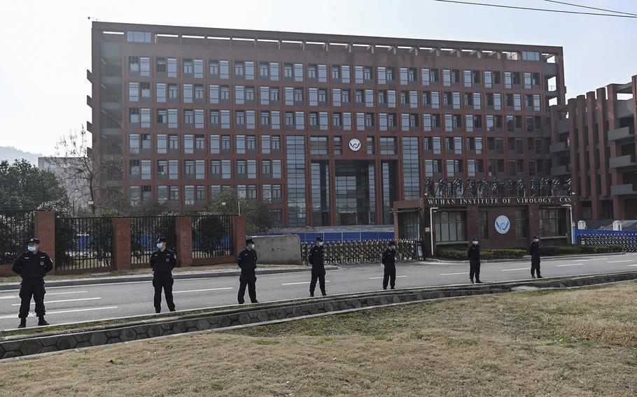 Guards stand outside the Wuhan Institute of Virology in Wuhan, China, on Feb. 3, 2021, as members of the World Health Organization team investigate the origins of the COVID-19 coronavirus. (Hector Retamal/AFP via Getty Images/TNS)