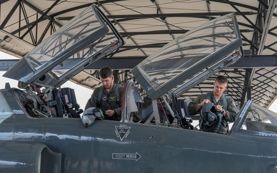 Air Force Capt. Cole Stegeman (left), 49th Fighter Training Squadron instructor pilot, and 1st Lt. Jared Rackers, 49th FTS Introduction to Fighter Fundamentals graduate, prepare for a flight in a T-38 Talon on Nov. 11, 2020, at Columbus Air Force Base, Miss.