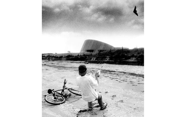 Normandy, France, June, 1994:  Fifty years after allied troops landed on Utah Beach to begin the push toward Berlin that ended World War II, a boy engages in the kind of struggle beaches are more suited for — attempting to control a kite against the winds of a gathering storm.  

Check out what will be happening on the Normandy beaches this year for D-Day's 80th anniversary on our Europe Community paper's D-Day page here.
https://europe.stripes.com/d-day/

META TAGS: DDAY80; Normandy; D-Day; WWII; World War II