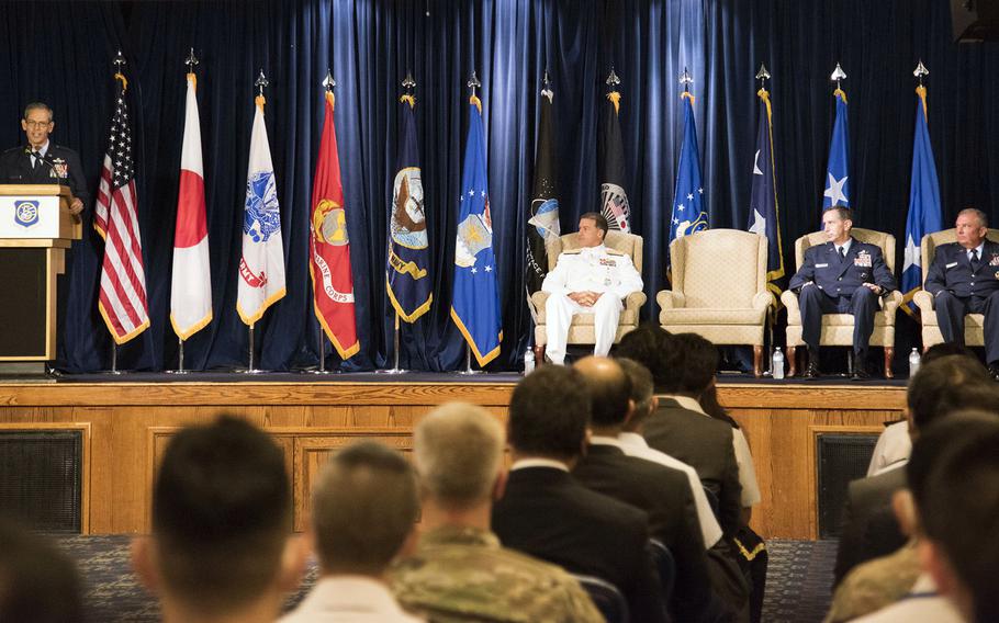 The commander of Pacific Air Forces, Gen. Kenneth Wilsbach, speaks during a change-of-command ceremony for U.S. Forces Japan and 5th Air Force at Yokota Air Base, Japan, Friday, Aug. 27, 2021.