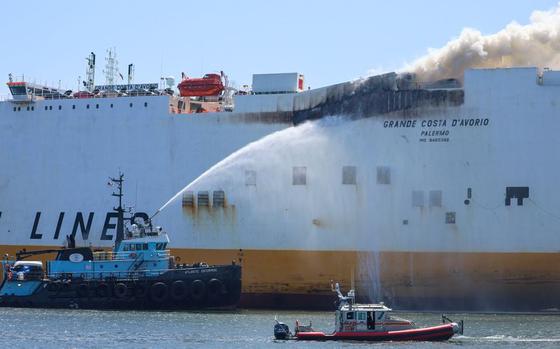 Fire continues to burn aboard the cargo ship Grande Costa DAvorio where two Newark firefighters were killed battling the fire early this morning. The tugboat Atlantic Enterprise (left) and New York City fireboats pour water on the blaze on Thursday July 6, 2023, in Newark, N.J.