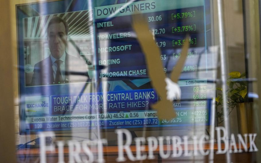 A television screen displaying financial news is seen inside one of First Republic Bank’s branches in the Financial District of Manhattan, Thursday, March 16, 2023.