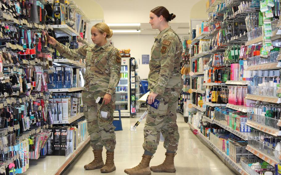 Air Force members shop at the exchange at RAF Lakenheath, England July 19, 2021, under guidelines that allow fully vaccinated service members to go without masks in base facilities, with some exceptions. 