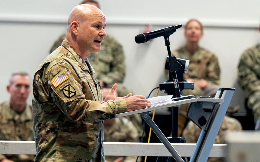 Cavoli speaks at a microphone.