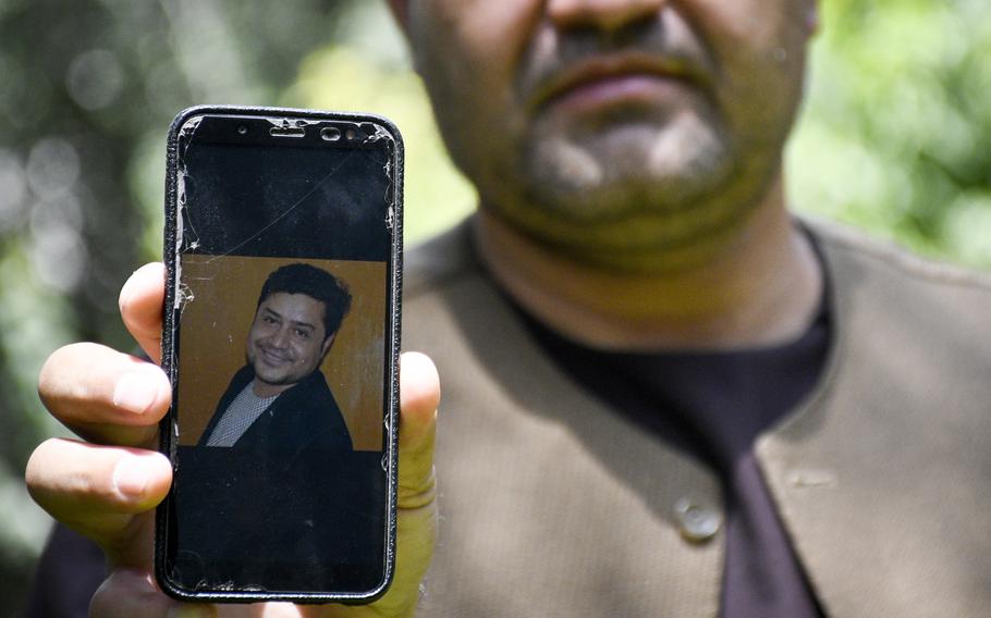 Afghan journalist Zainullah Stanikzai keeps photos on his phone of Aliyas Dayee, his friend and a fellow reporter, who was killed Nov. 12, 2020 in southern Helmand province when a bomb attached to his car detonated. Stanikzai said on Aug. 2, 2021 that he hopes to come to America through a program to allow those who worked for U.S. media companies and are under threat to receive a visa.