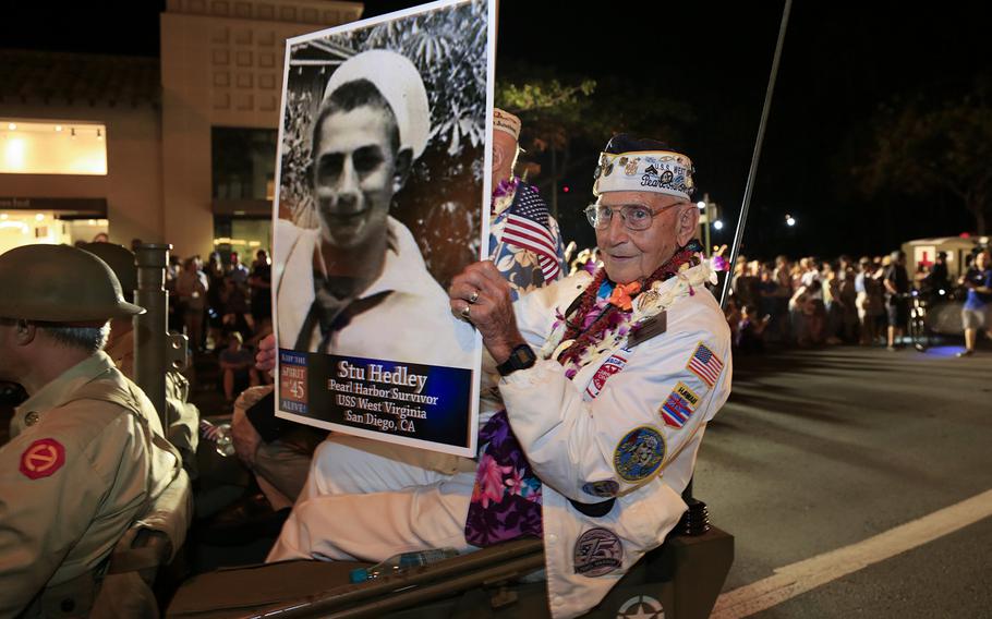 San Diego resident and Pearl Harbor survivor Stu Hedley rode in the back of a jeep during the Pearl Harbor Memorial Parade through the streets of Honolulu, Hawaii, on December 7, 2016.