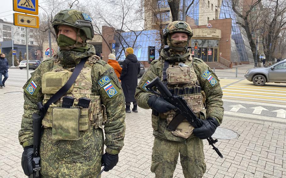 In this handout photo released by Russian Defense Ministry Press Service, Collective Security Treaty Organization peacekeepers guard an area in Almaty, Kazakhstan, Tuesday, Jan. 11, 2022. The president of Kazakhstan has announced that a Russia-led security alliance will start pulling out its troops from the country in two days after completing its mission. The mostly Russian troops were deployed to Kazakhstan last week by the Collective Security Treaty Organization, an alliance of six former Soviet states, at the president’s request amid unprecedented public unrest.