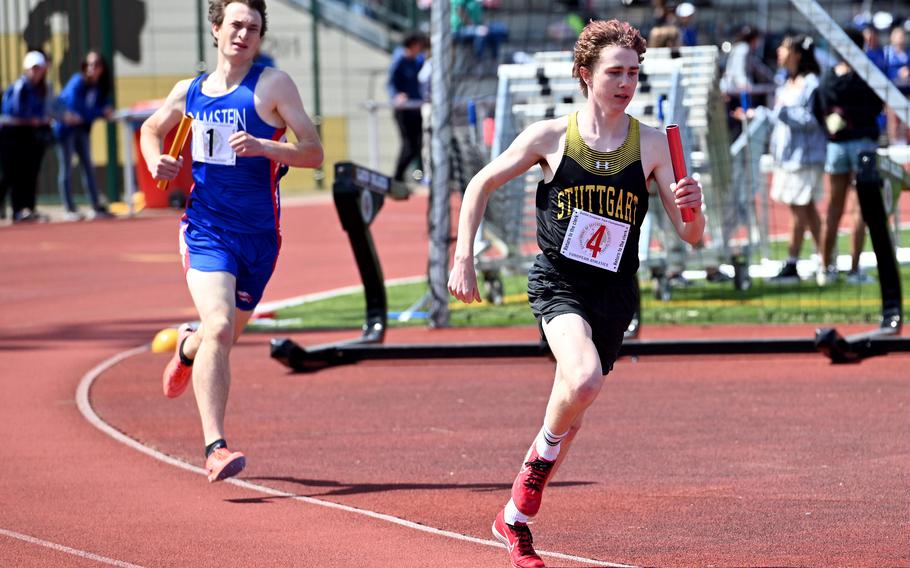 Alexander Daniels of Stuttgart anchors his team in the 4x800-meter relay at the DODEA-Europe track and field championships in Kaiserslautern, Germany, May 19, 2023, Daniels and teammates William Morken, Carter Lindsey and Tobin McArthur won in 8 minutes, 14.98 seconds. At left is Max Furqueron of the second-place Ramstein team.