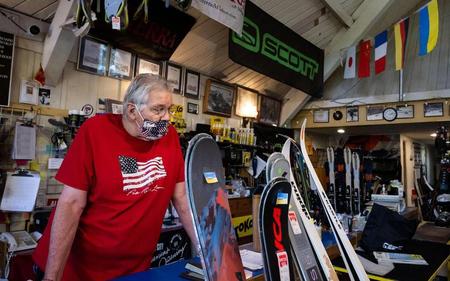Bill Proffit, owner of longtime Sacramento establishment Land Park Ski & Sports, stands behind a selection of skis Tuesday, Aug. 9, 2022, that were made in Ukraine, a key manufacturer in the ski industry. The business is one of many ski retailers impacted by the war in Ukraine after Russias invasion earlier this year.