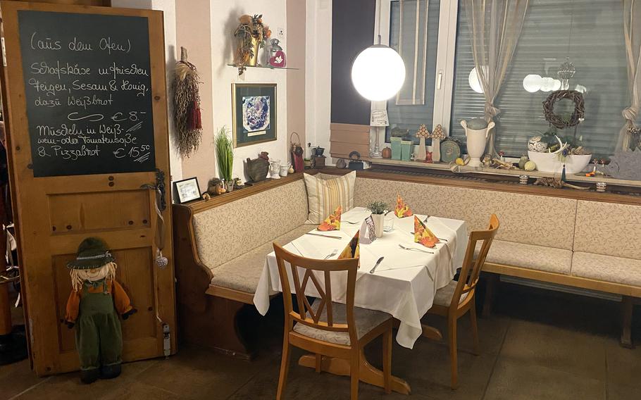 The interior of Pizzeria Antonio in Sulzbach-Rosenberg. The eatery is within driving distance of Vilseck and offers pizza, pasta and other Italian dishes. The board at left announces daily specials.