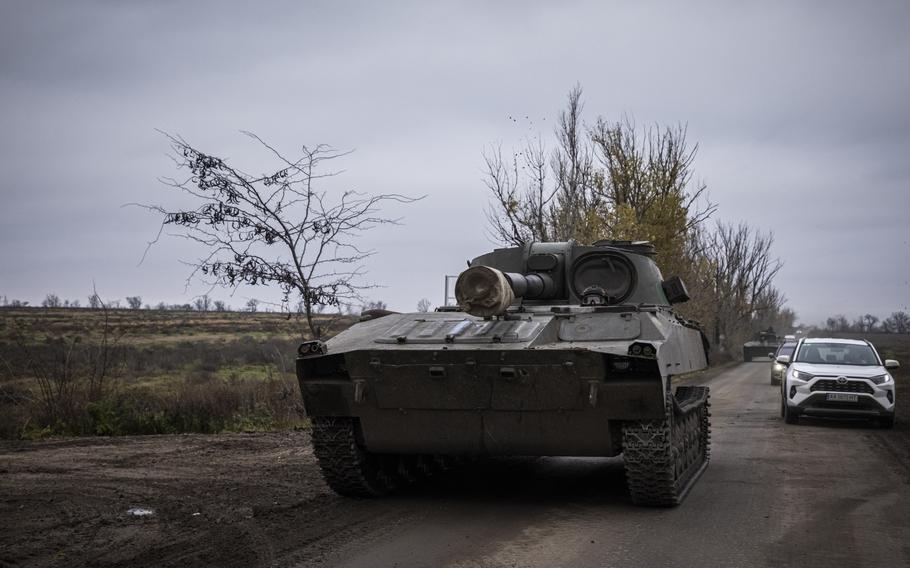 Ukrainian soldiers drive a self propelled howitzer down a country road in Kherson Region, Ukraine. Ukrainian troops are regrouping after liberating Kherson and preparing to continue their fight over winter. 