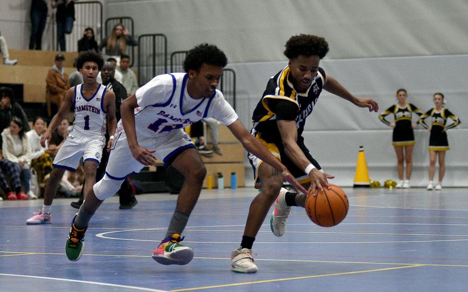 Stuttgart's Tyler Jackson steals the ball off Ramstein's Jahrid Longsworth during a basketball game on Dec. 8, 2023, at Ramstein High School on Ramstein Air Base, Germany.