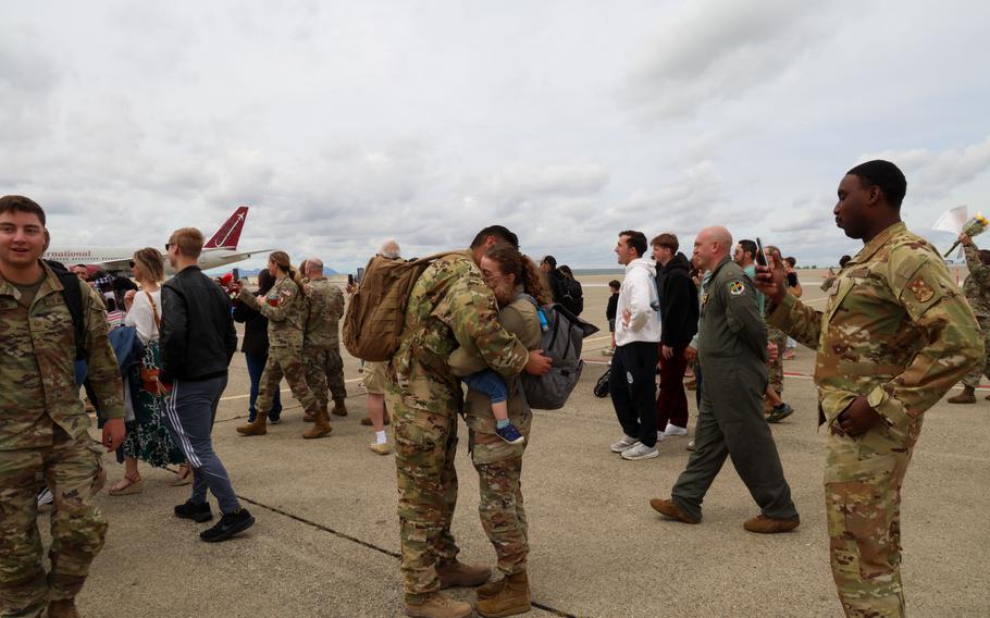 An airman embraces a loved one