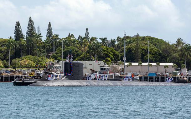 A submarine seen above the water.