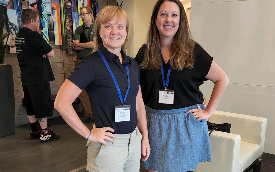Rebecca Carter, left, a doctor of biochemistry and chief development officer for Ophirex Inc., and Lindsey Garver, a doctor of microbiology and immunology and product manager at U.S. Army Medical Materiel Development Activity, photographed on July 22, 2022.