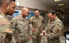 Airmen at Joint Base Pearl Harbor-Hickam, Hawaii, check out a smartwatch April 12, 2023, that is programmed to monitor stress.