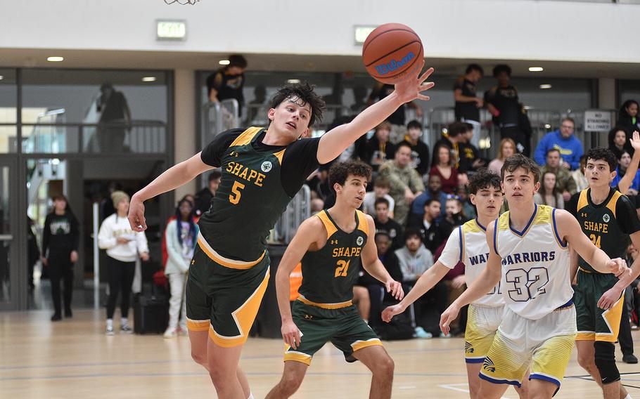 SHAPE senior Bela Clobes tries to corral the ball during pool-play action of the DODEA European basketball championships agianst Wiesbaden on Feb.14, 2024, at the Wiesbaden Sports and Fitness Center on Clay Kaserne in Wiesbaden, Germany.