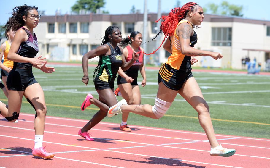 Kadena senior Sharday Baker won the girls 100 despite being hampered by a right hamstring injury.