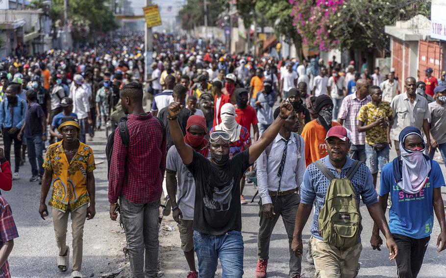 Demonstrators fill the streets during a protest to demand the resignation of Prime Minister Ariel Henry, in the Petion-Ville area of Port-au-Prince, Haiti, on Oct. 3, 2022. 