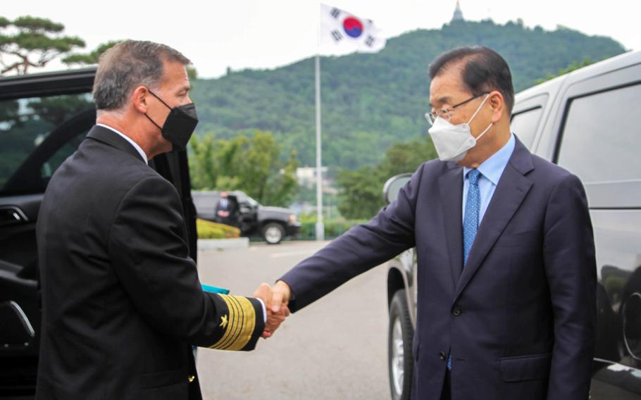 Adm. John Aquilino, the head of U.S. Indo-Pacific Command, greets South Korean Foreign Minister Chung Eui-yong in Seoul, South Korea, Thursday, June 3, 2021. 