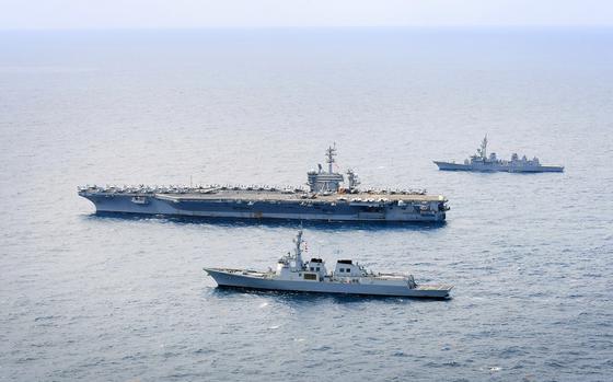 The aircraft carrier USS Theodore Roosevelt trains with the Japanese destroyer JS Ariake, top, and South Korean destroyer Seoae Ryu Seong-ryong south of Jeju Island, South Korea, April 11, 2024.
